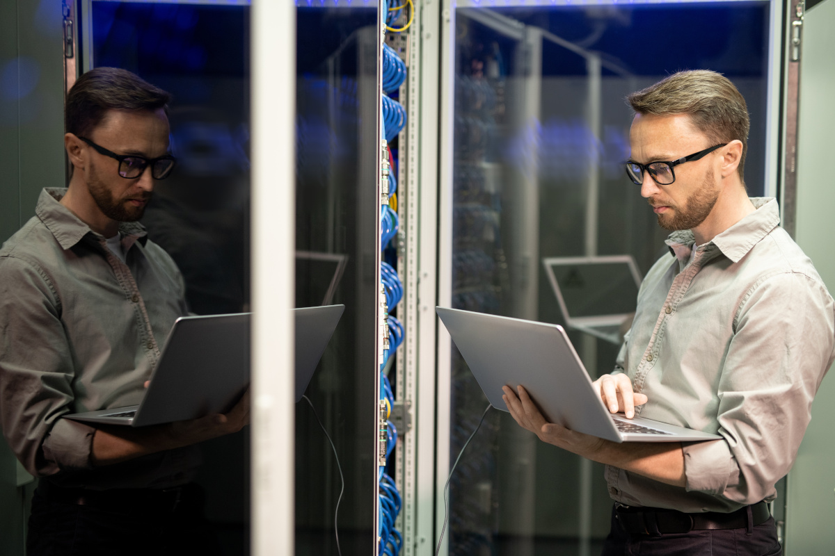 A person performing an assessment on network hardware