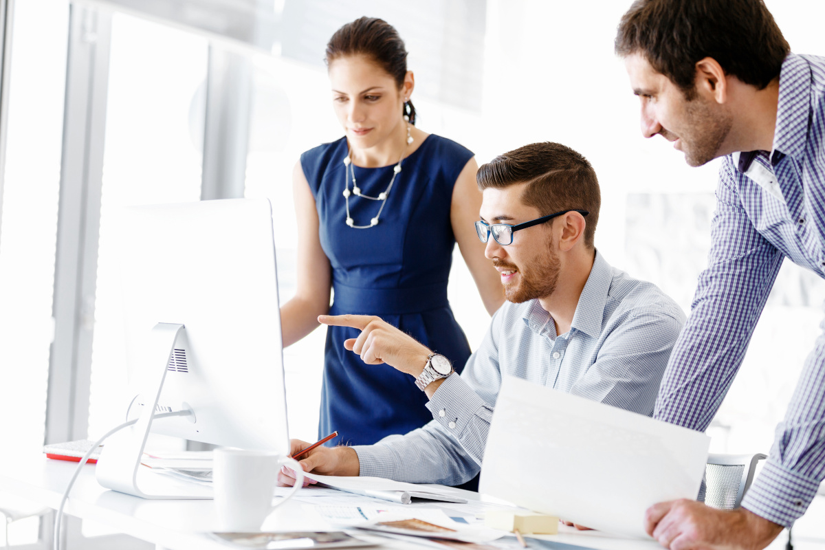 Three business people working together
