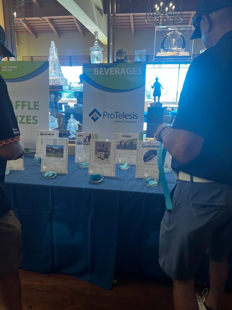 A shot of the a ProTelesis flyer showing that they sponsered the drinks at the San Ysidro Health's 16th Annual Clasico de Golf tournament award handouts.