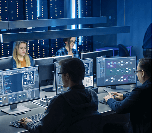 Business People at Desks in Monitoring Center